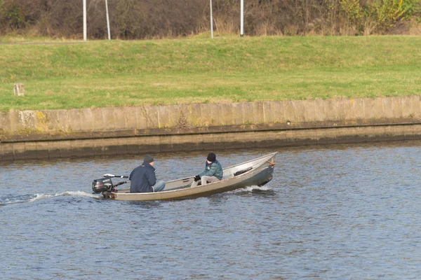 Fishing people in small motorboat — Stock Photo, Image