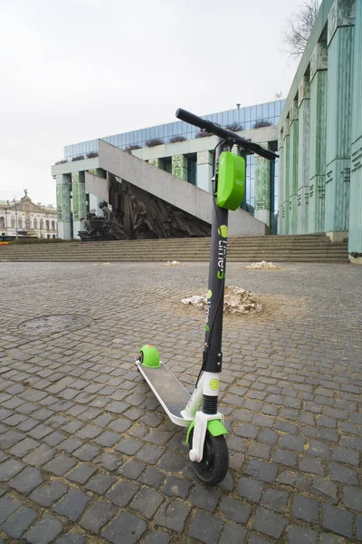 stock image WARSAW, POLAND - DECEMBER 24, 2018: electric rental scooter in front of the Warsaw uprising monument