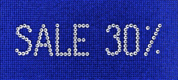 Word SALE dibuat rhinestones warna kristal pada bac kanvas biru — Stok Foto