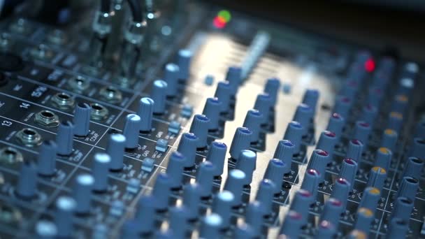 Professional audio console in a concert, sound mixer console during a concert, audio Mixer, control engineer, selective focus, audio mixer, shallow depth of field — Stock Video