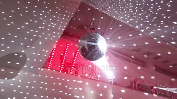 Disco ball at the New Year party, people having fun in the background — Stock Video