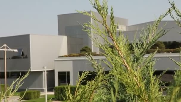 Modern office building, Exterior of modern storehouse or factory, green plants, exterior of the modern plant, building exterior, with air, industrial exterior, modern factory — Stock Video