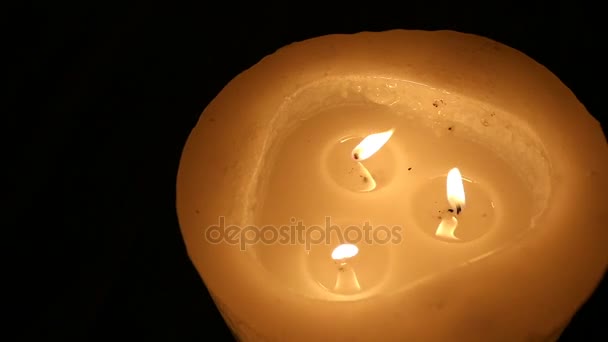 Lighting round candle viewed from above , on dark background, New Year, Christmas, New Years decorations — Stock Video