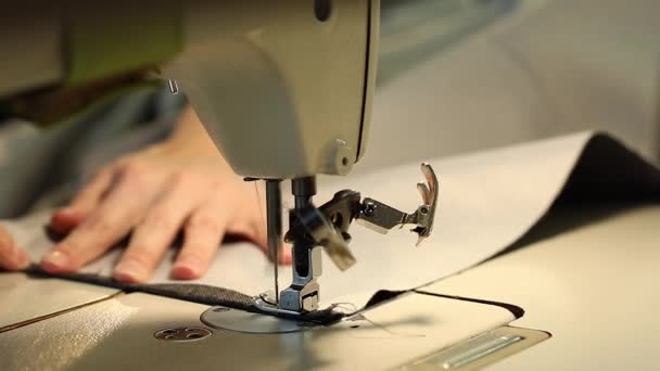 Woman working at a sewing machine, needle sewing machine, female hands, Slow Motion Video, close-up, shallow depth of field — Stock Video