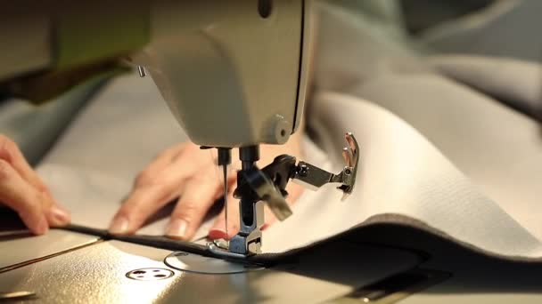 Woman working at a sewing machine, needle sewing machine, female hands, Slow Motion Video, close-up, shallow depth of field — Stock Video