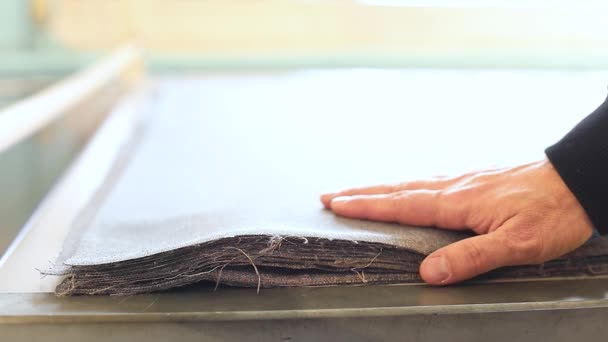 Samples of fabric for upholstery the furniture, a stack of furniture fabrics on the table, fabric furniture, business designer hands, close-up, Slow Motion Video — Stock Video