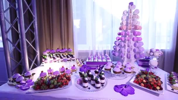 Sweets on buffet table, wedding, the table with sweets, dessert buffet, beautiful alcoholic shots — Stock Video