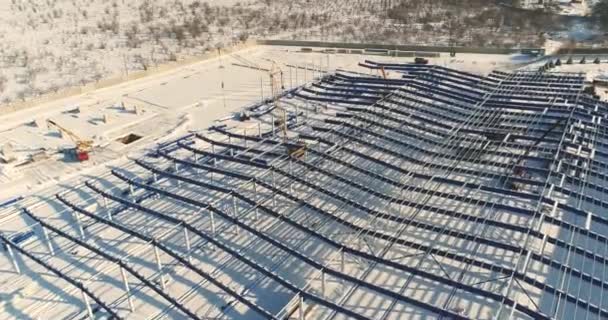 Modern storehouse construction site, the structural steel structure of a new commercial building, Construction of a modern factory or warehouse, modern industrial exterior — Stock Video