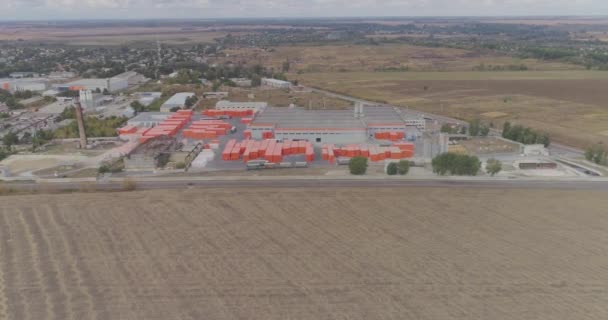 Modern factory top view, flying around a new modern factory in orange colors. Industrial exterior of a modern factory — Stock Video