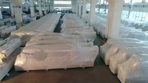 Flying above the machines packed and ready for transportation. Flying on drone over finished machines that are ready to be shipped to customers — Stock Video