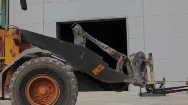 Orange bulldozer close-up, bulldozer in the factory — Stock Video