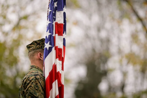 US Army soldier with US flag