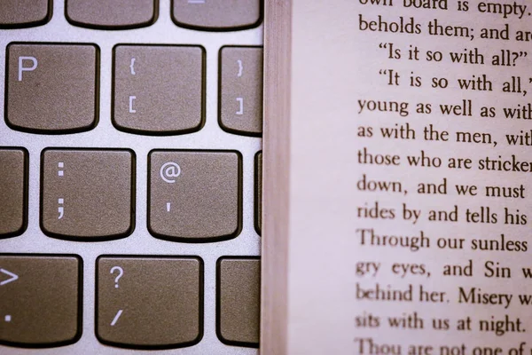 Closeup of classical english book on laptop keyboard