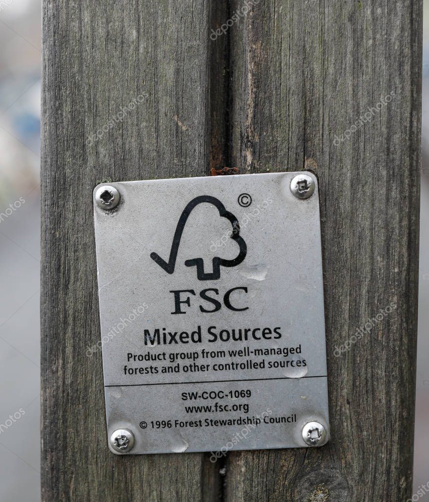 Bucharest, Romania -december 23, 2019: Details of a FSC (Forest Stewardship Council) logo tag on a piece of wood on a kids playground.