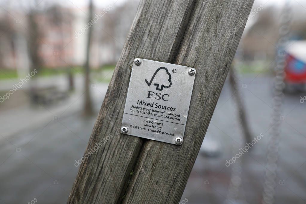 Bucharest, Romania -december 23, 2019: Details of a FSC (Forest Stewardship Council) logo tag on a piece of wood on a kids playground.