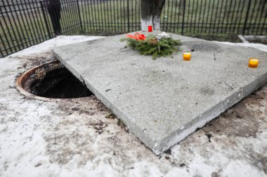 The manhole where the ashes of the burned bodies of victims from