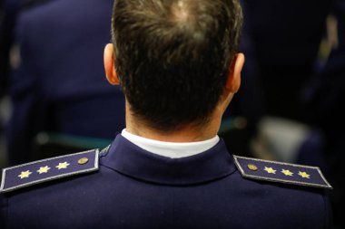 Bucharest, Romania - February 17, 2020: Shallow depth of field (selective focus) image with details of a Romanian Border Police patch and insignia.