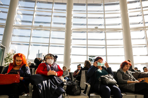 Otopeni, Romania - February 25, 2020: Passengers inside Henri Coanda International Airport, near Bucharest, Romania.