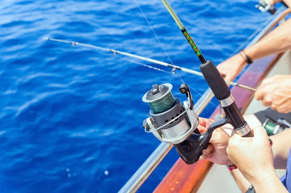 Fishermen fishing from boat in sea — Stock Photo, Image