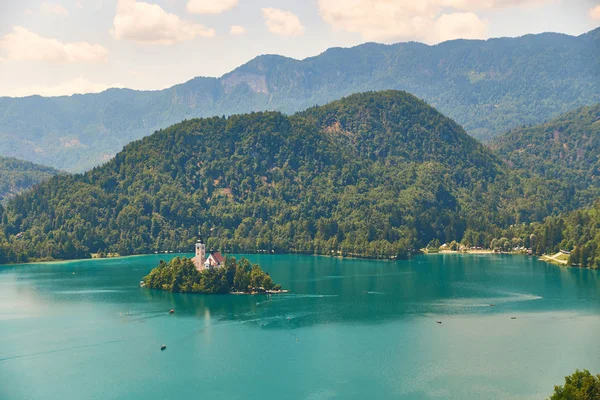 Vew of Bled lake with mountains, island and pilgrimage church, view from the Bled Castle upper yard, Slovenia. Royalty Free Stock Photos