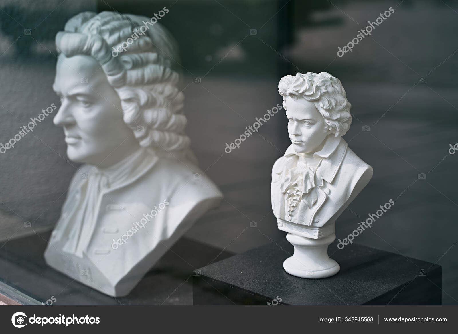 White gypsum busts of Ludwig van Beethoven and Wolfgang Amadeus Mozart