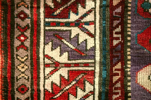 Sample with folk ethnic geometric patterns on the edge of rug — Stock Photo, Image