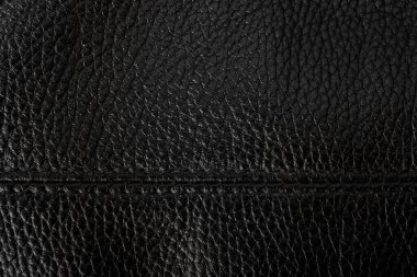 Dikişi olan siyah deri bir arka plan