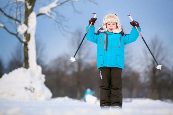 Cute little boy having fun during skiing on cross outdoors — Stock Photo, Image