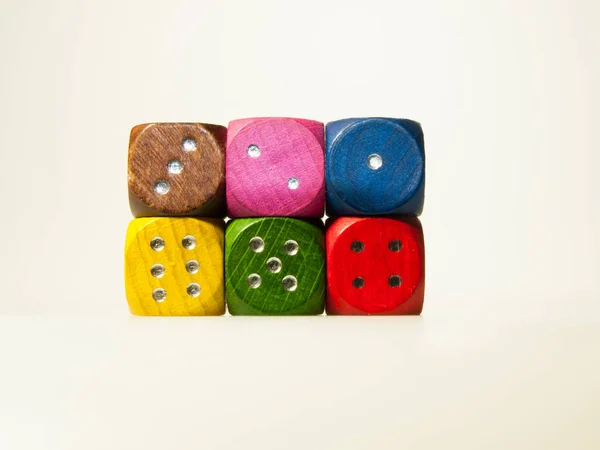 Multicolored wooden game dices with six numbers — Stock Photo, Image