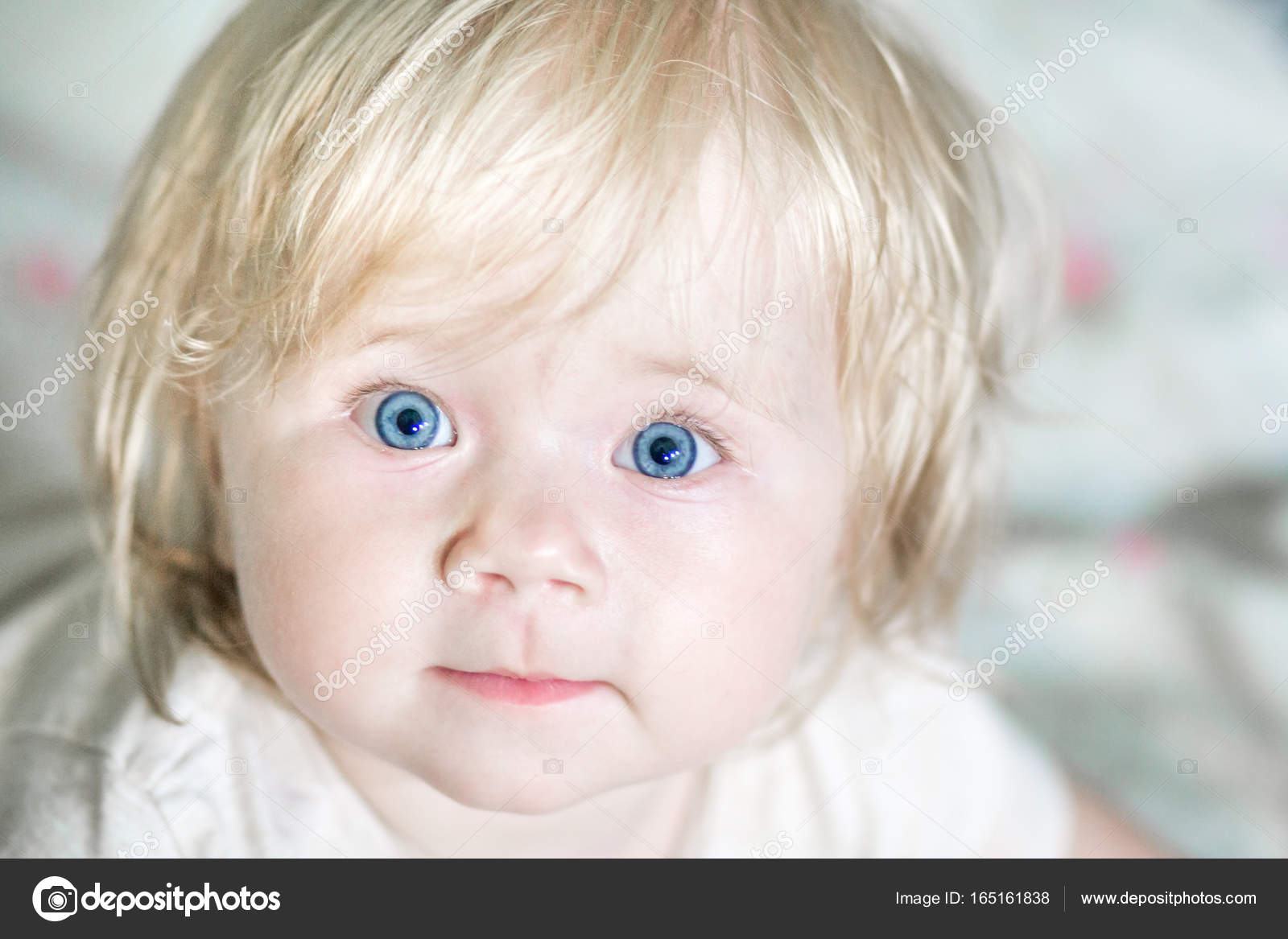 A Little Cute Baby With Blue Eyes Stock Photo C Yuriiz 165161838