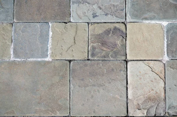 따뜻한 색상에 돌 바닥입니다. 다양 한 크기의 돌 벽돌의 배경입니다. 상위 뷰. — 스톡 사진