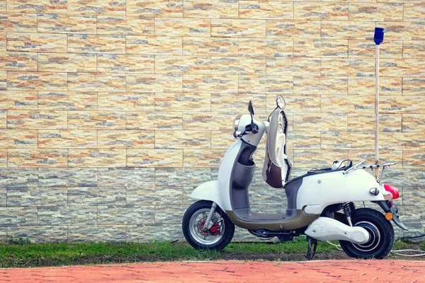 Electric motor scooter on charging. — стоковое фото