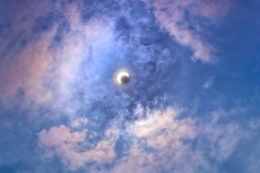  Solar eclipse in the clouds clipart