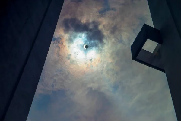 Sky with solar eclipse surrounded by skyscrapers. — 스톡 사진