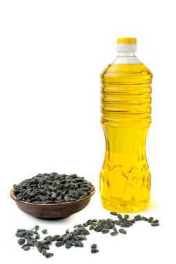 Beyaz arka plan solated üzerinde pot bottel yağda ayçiçeği tohumu