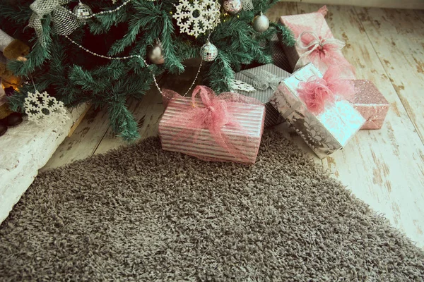 Christmas presents under the fir — Stock fotografie