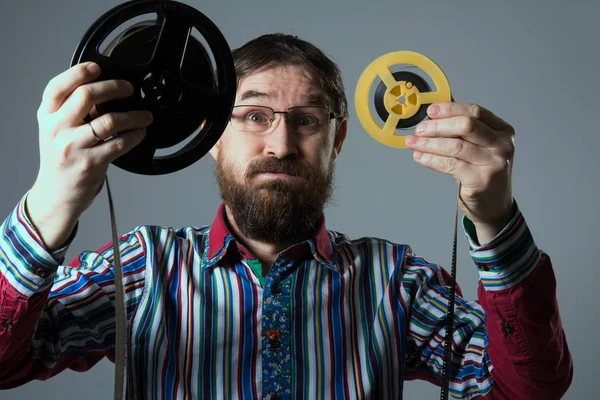 Bearded man with two film reel — Stock Photo, Image