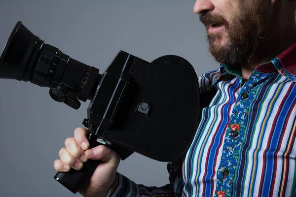 Bearded Man Movie Camera thoughtfully — Stock Photo, Image