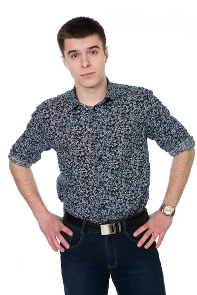 Standing young man in shirt hands on his belt — Stock Photo, Image