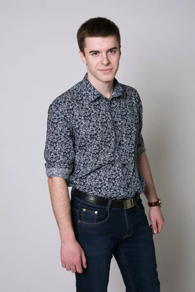 Portrait of a smiling young man in a shirt — Stock Photo, Image