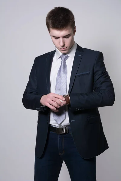 Portrait of confident business man looking at his watch — Stock Photo, Image