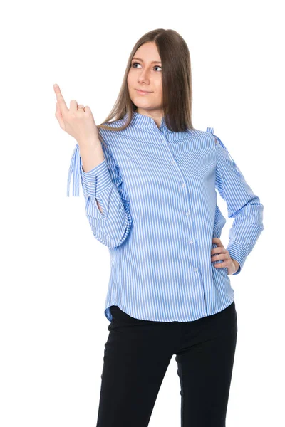 Una joven sonriente con una camisa a rayas señala con el dedo —  Fotos de Stock