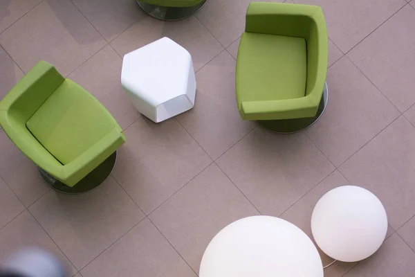 Top view of green leather chairs and round white lamps — Stock Photo, Image