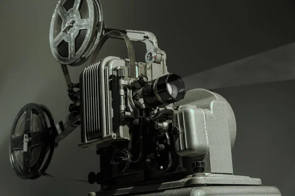 Old cinema projector on a dark background — Stock Photo, Image
