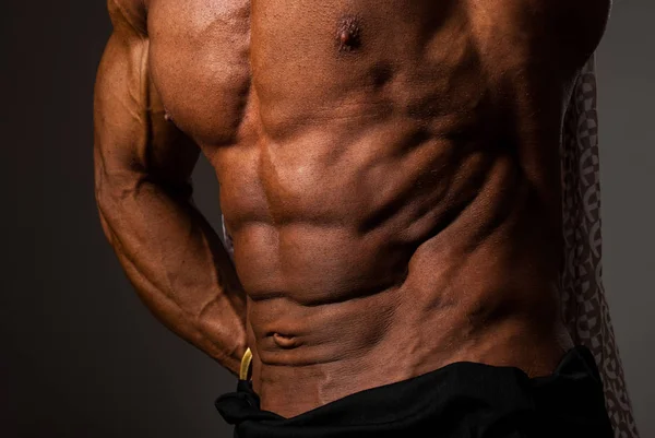 Muscular torso of sexy young male bodybuilder power — Stock Photo, Image