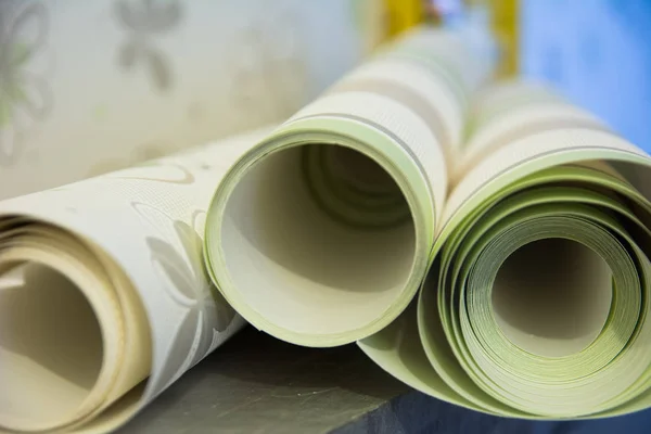 Three rolls of vinyl wallpaper for room repair — Stock Photo, Image