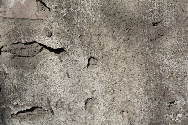 Gros plan d'un vieux mur de sable grunge avec du ciment — Photo