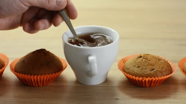 Hand Stirs Spoon Coffee White Cup Next Cupcakes — Stock Video