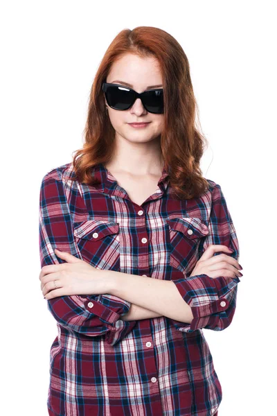 Young girl with arms crossed in plaid shirt — Stock Photo, Image