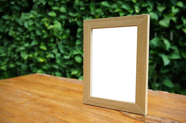 Mock up Blank white frame standing on wood table in Bar restaura — Stock Photo, Image